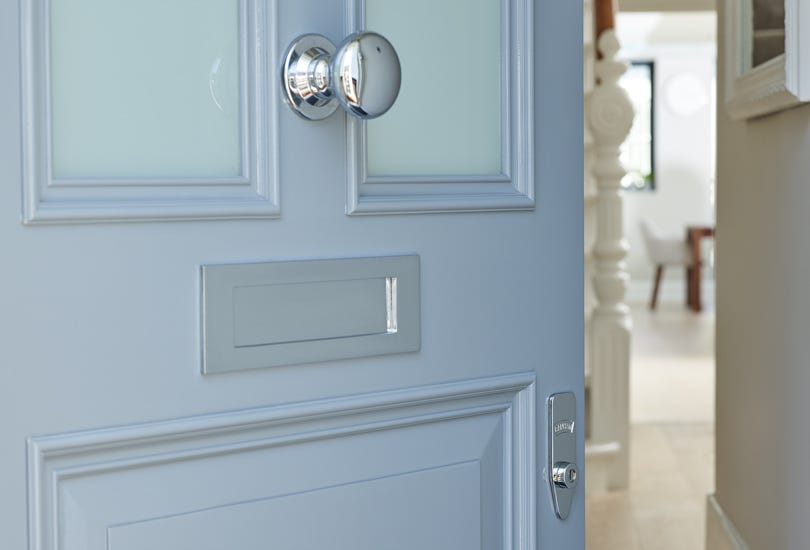 Satin Brass Door Lock on Blue Door