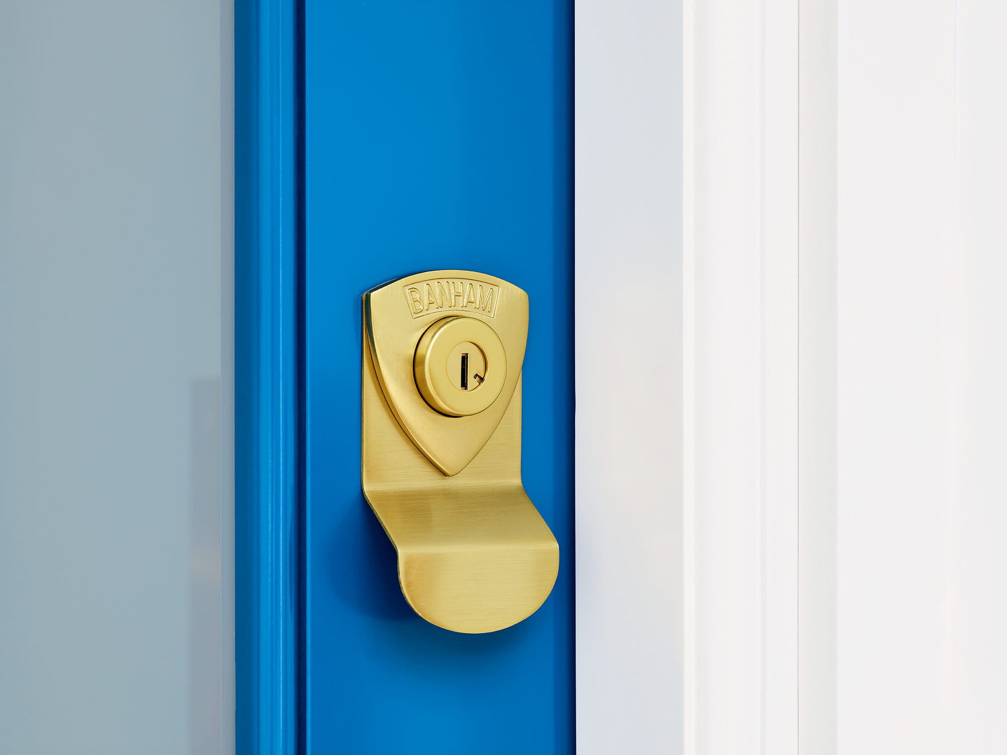 Satin Brass Door Lock on Blue Door